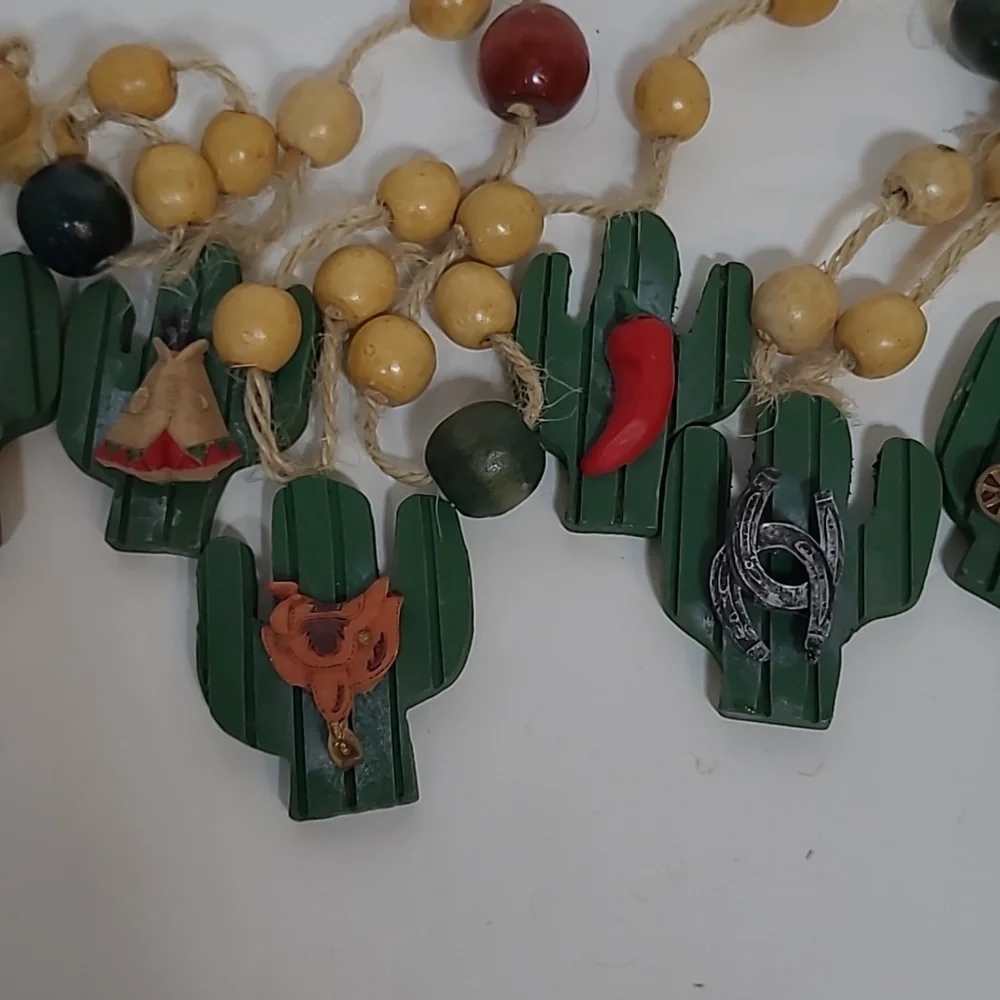 Vintage resin cactus western Christmas garland. Approximately 85 inches long